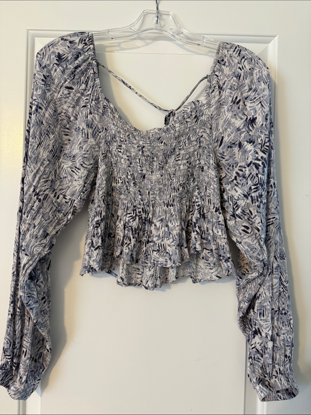 vestique Smocked Long Sleeve Crop Top in White and Navy Abstract Print
